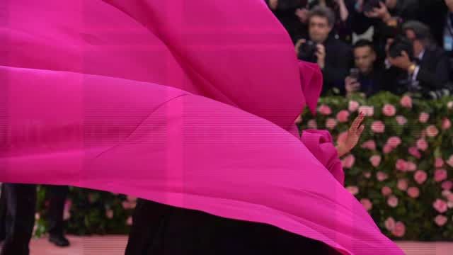 preview for Lady Gaga performs a strip tease at the 2019 Met Gala