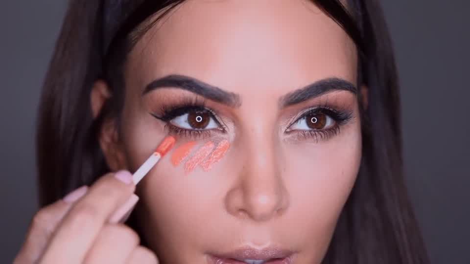 preview for Kim Kardashian's new under-eye concealer hack is actually genius