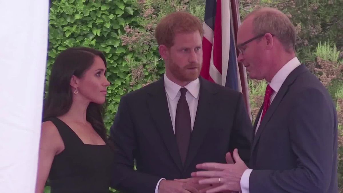 preview for Meghan Markle Wears A Sleeveless Little Black Dress During Garden Party