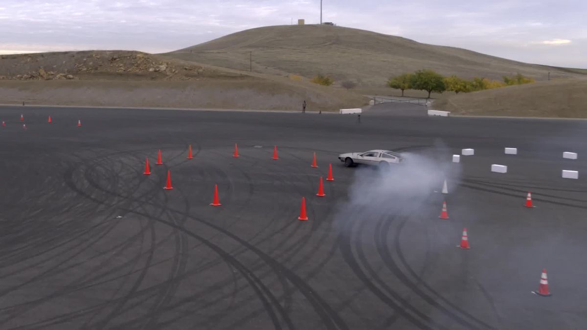 preview for WATCH: Self-driving DeLorean drifts through kilometer-long racecourse