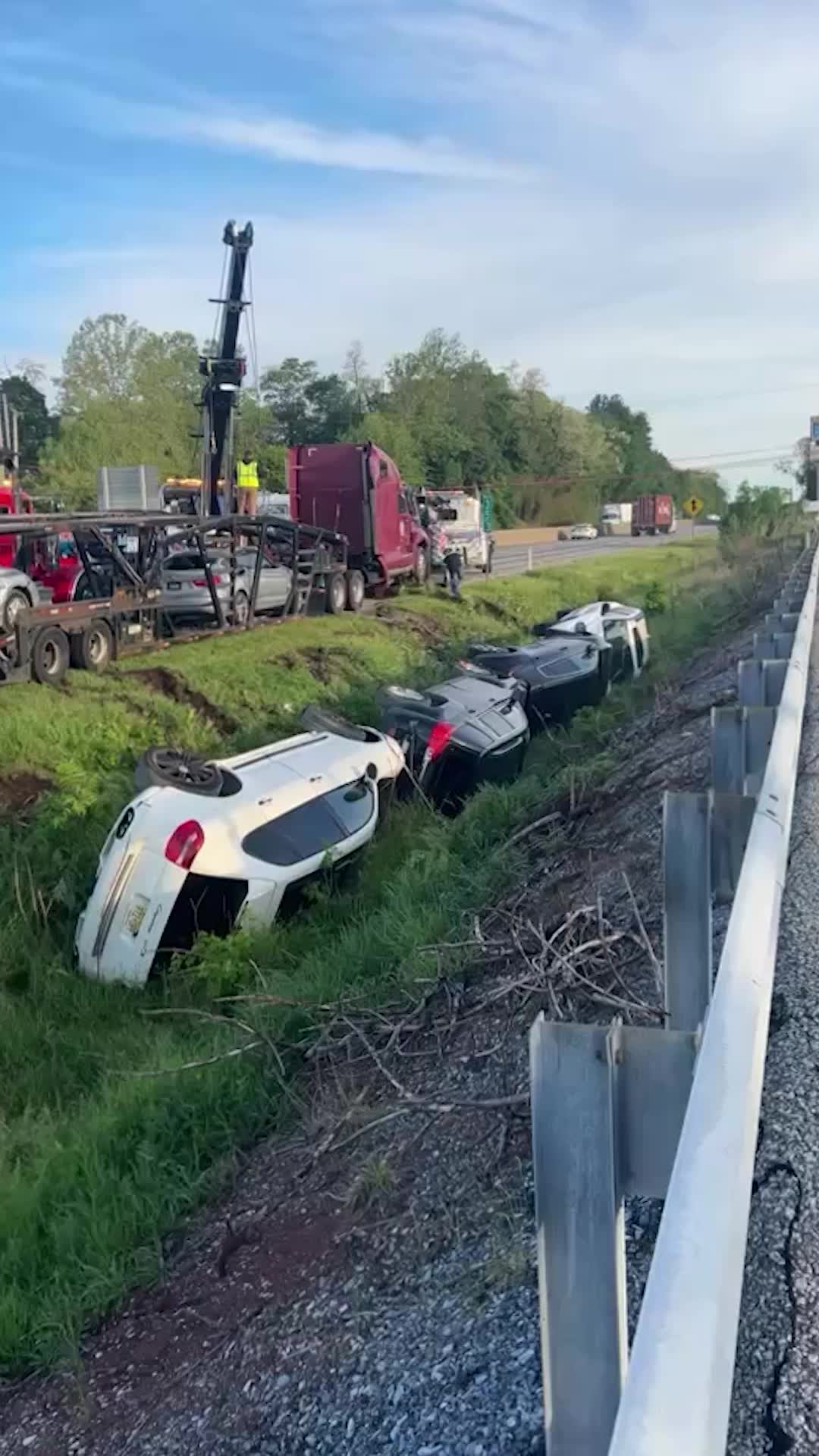 Four SUVs spill into ditch after car carrier flips over on I-83 in York County, Pa.