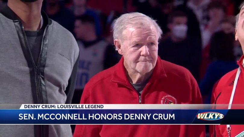 Former U of L coach Denny Crum shows off his sports collection