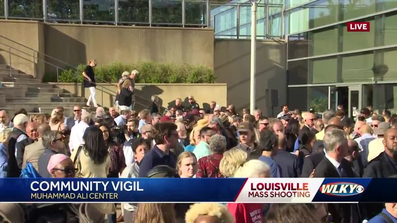 Community members gather at site of Louisville mass shooting, pay