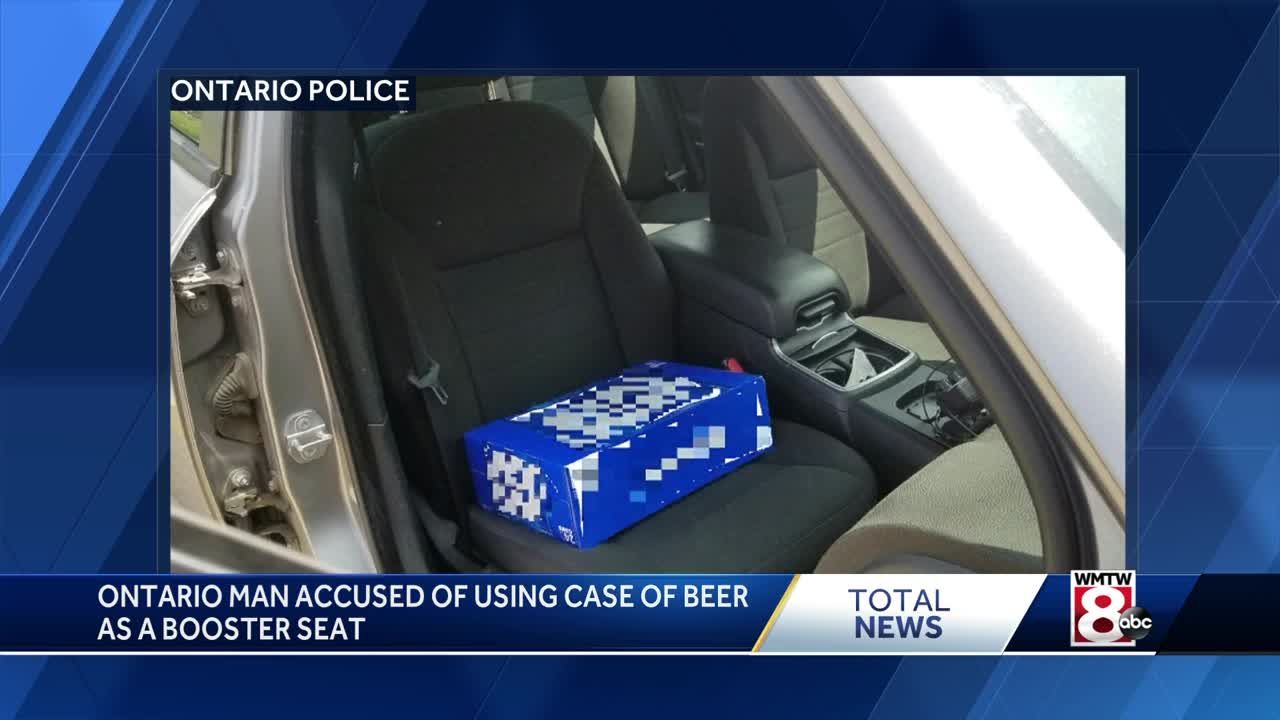 Police charge driver for allegedly using 30 pack of beer as child's booster  seat