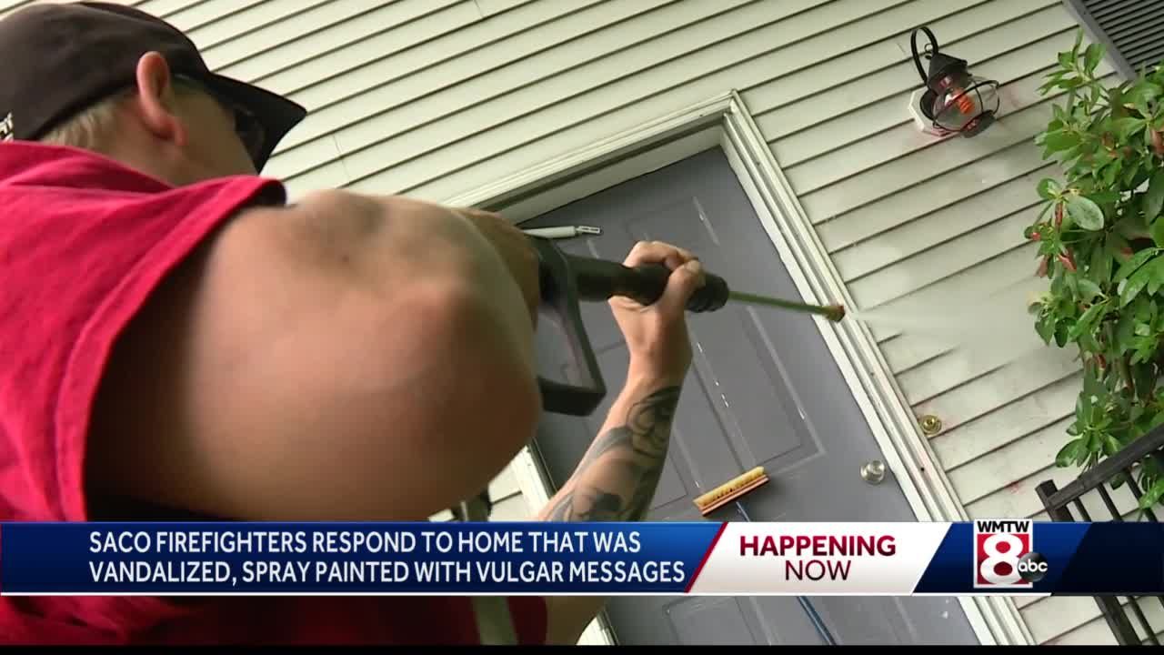 Firefighters rally to clean up messages of hate spray-painted on walls