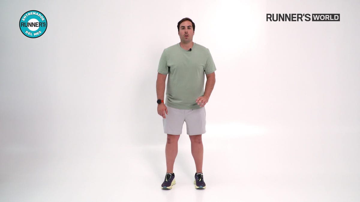 muscular sprinter in stating blocks