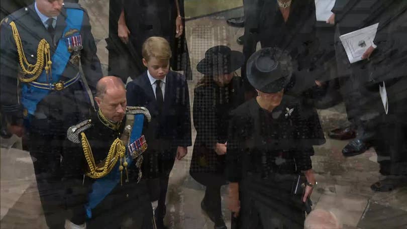 Royal funeral guests wear quiet tributes to the Queen