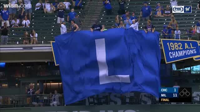 Brewers fan flies giant 'L' flag at Miller Park