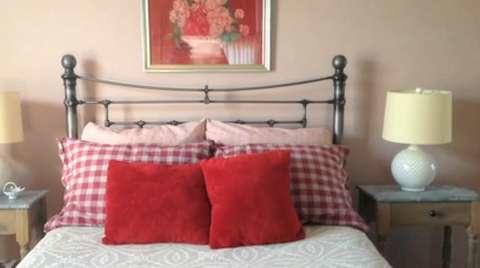 preview for A Guest Bedroom Goes From Bubble Gum To The Perect Shade Of Pink