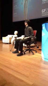 preview for Global Future 2045 Congress: Dr. Hiroshi Ishiguro's robotic avatar on stage at Alice Tully Hall.