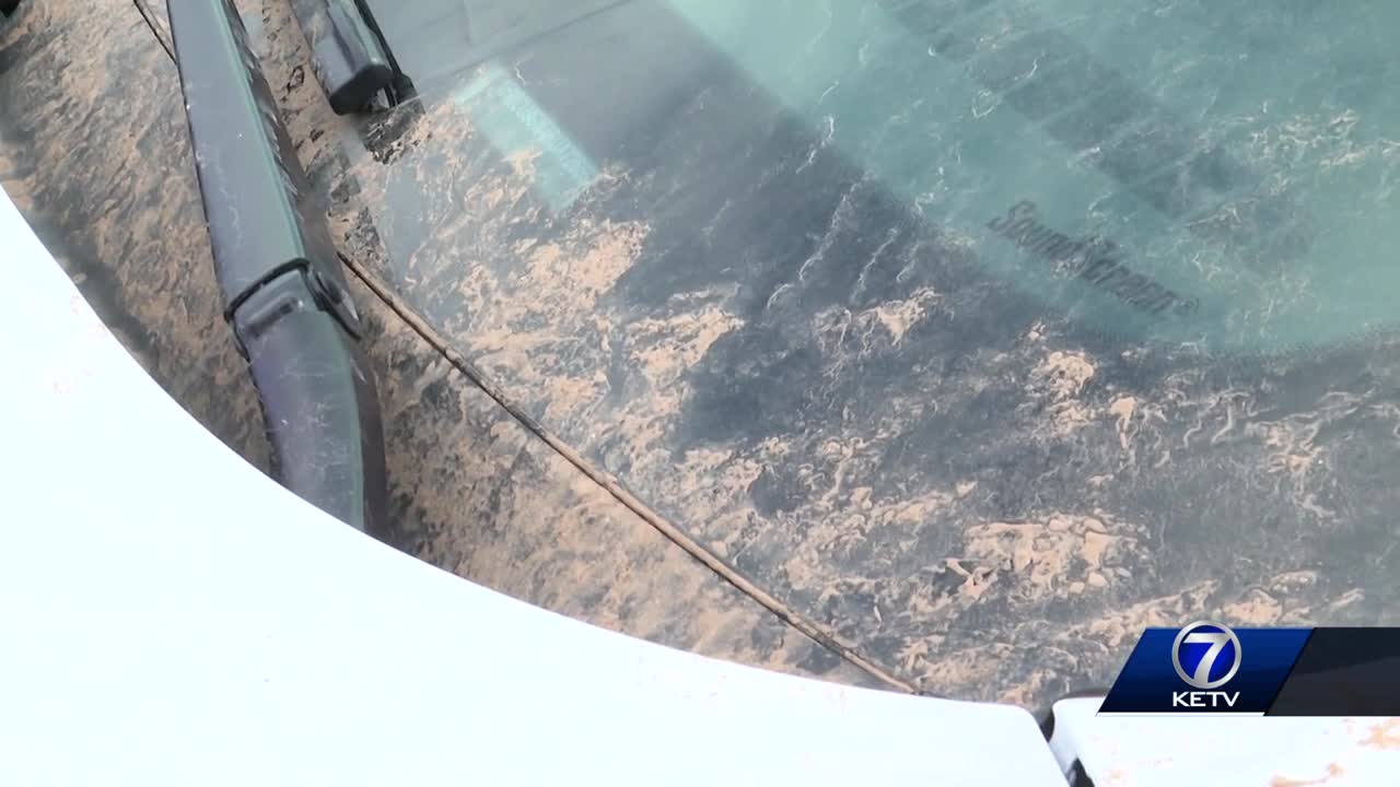 Omaha power washers, window cleaners face new problems after storm leaves vehicles, houses covered in red dirt
