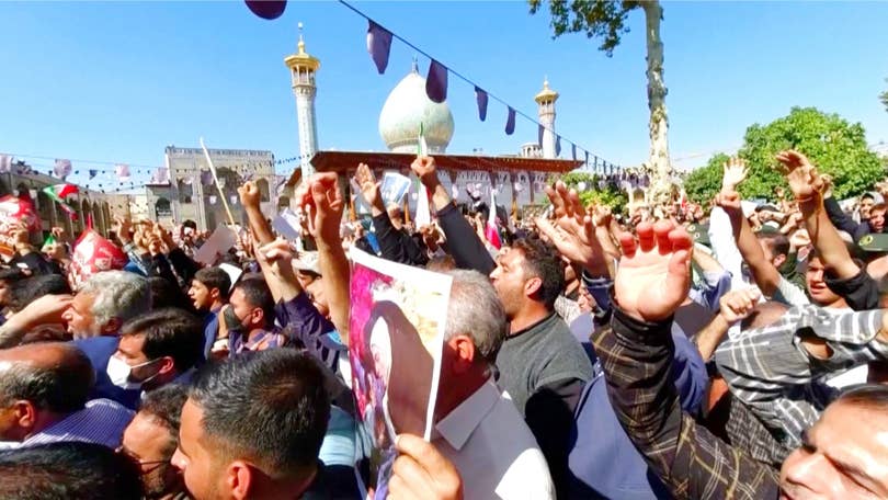 Iran government supporters confront protesters at World Cup