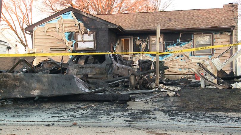 Holiday house fire destroys new homeowners' garage, damages house