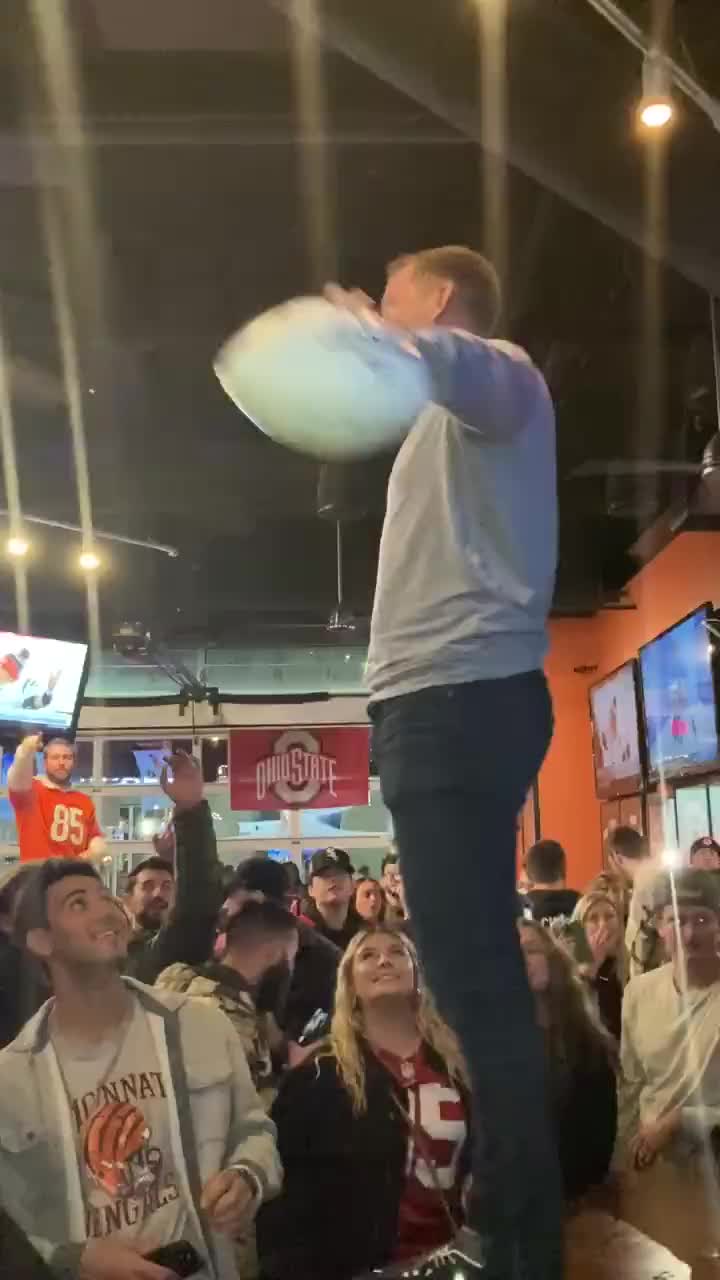 Kevin Huber, C.J. Uzomah Deliver Game Ball to Local Bar Following