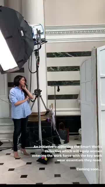 preview for Meghan Markle speaks to photographer at her charity capsule collection shoot