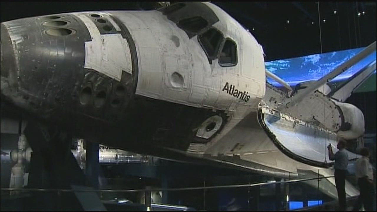 Space Shuttle Atlantis exhibit opening with support from souvenirs