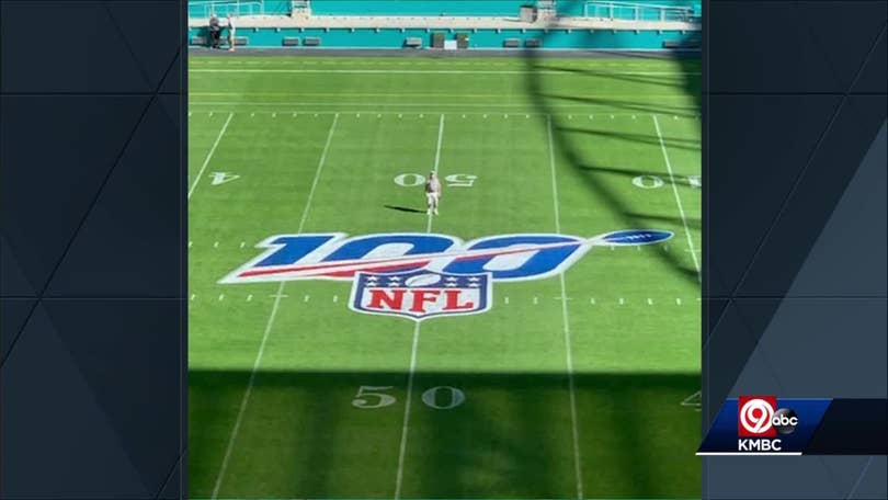 Longtime KC groundskeeper George Toma shows off his Super Bowl LIV