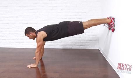 Mountain Climber with Feet Against Wall