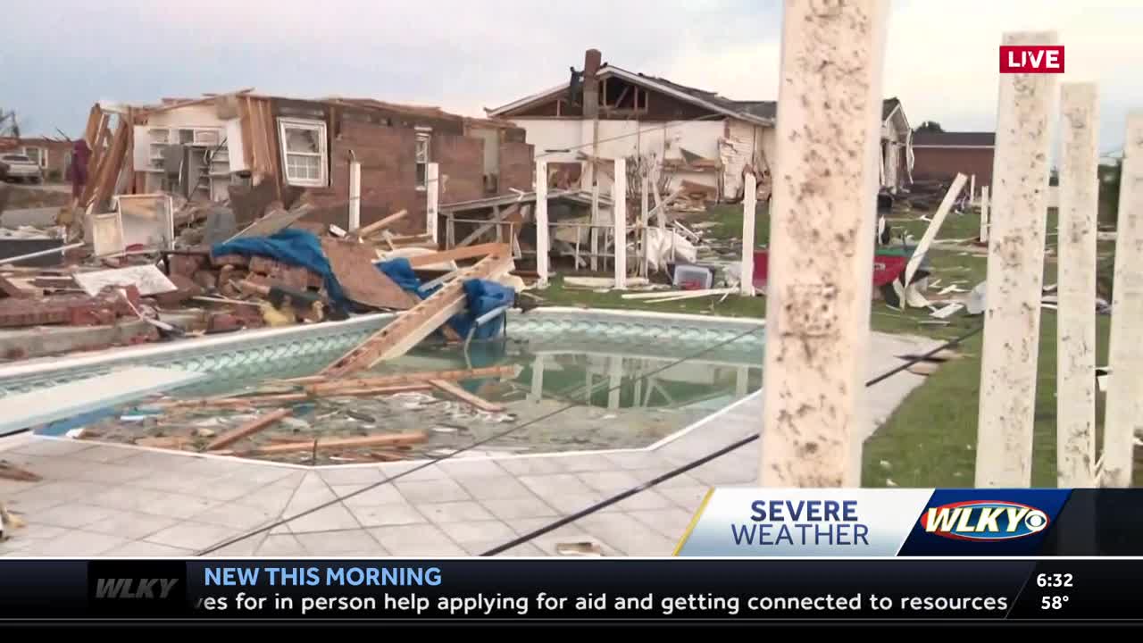 A look at the tornado damage in Laurel County, KY; pool full of debris in devastated neighborhood