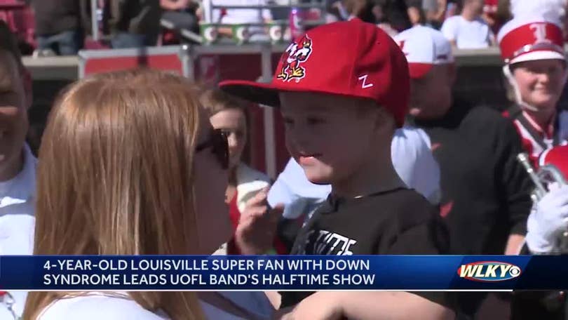 Allen Norton leads Louisville Cardinals band during halftime