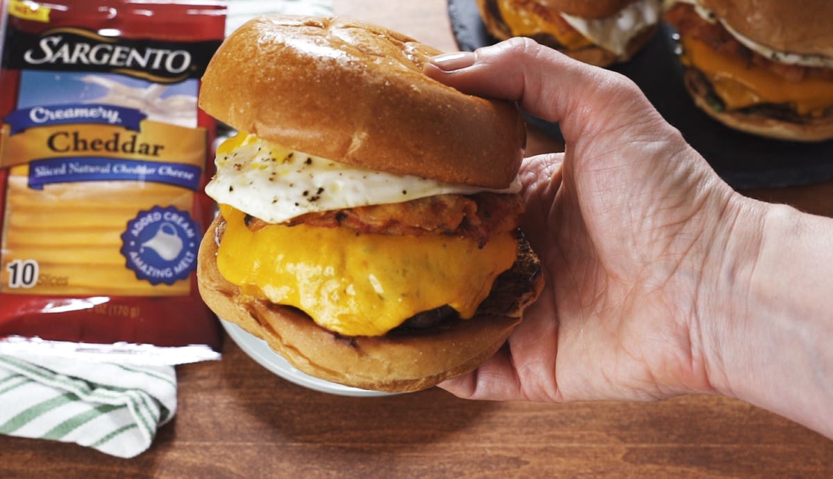 Video player poster image preview for Creamy Chilaquiles Burgers Get Melty Cheese, Saucy Chips, AND a Fried Egg