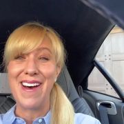 Hair, Face, Facial expression, Blond, Smile, Driving, Vehicle door, Fun, Luxury vehicle, Vehicle, 
