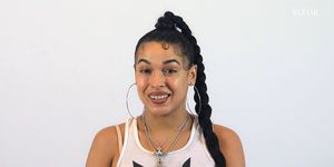 princess nokia smiles at the camera against a white background