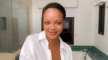 rihanna smiles into the camera while in her bathroom