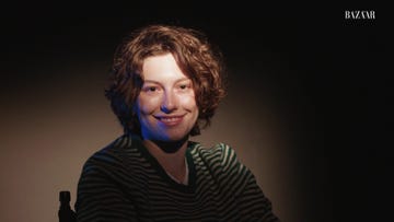 king princess smiles into the camera