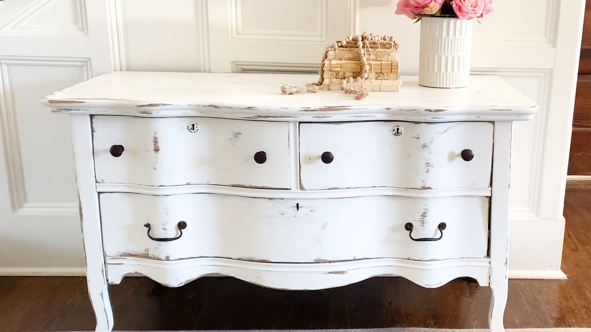 Antique dresser painted in black chalk paint, distressed and