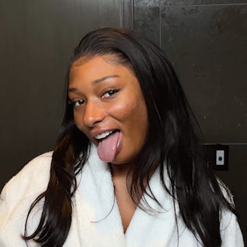 megan thee stallion smiles into the camera