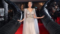 Angelina Jolie Wears Tan Tie Dress and Dior Purse