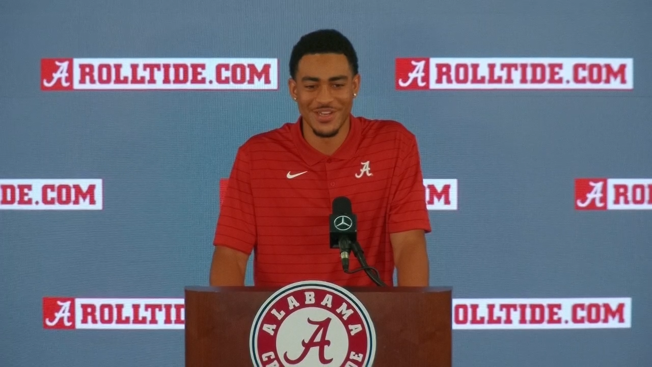 Alabama center Chris Owens (79), receiver John Metchie III (8