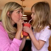 jo saltz and her daughter drinking a strawberry lemonade slushie