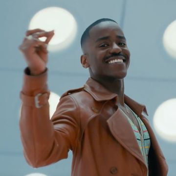 ncuti gatwa, as the fifteenth doctor on doctor who, smiles and lifts the fingers of his right hand in a snapping motion