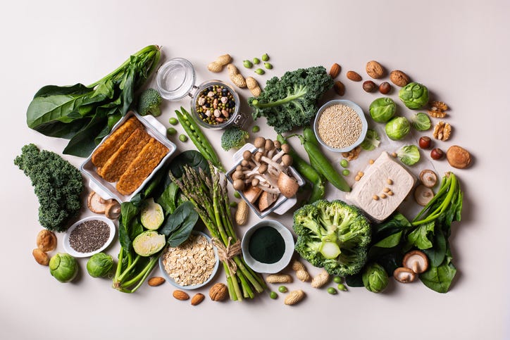 closeup of young asian athletic woman preparing protein shake at home diet and healthy food
