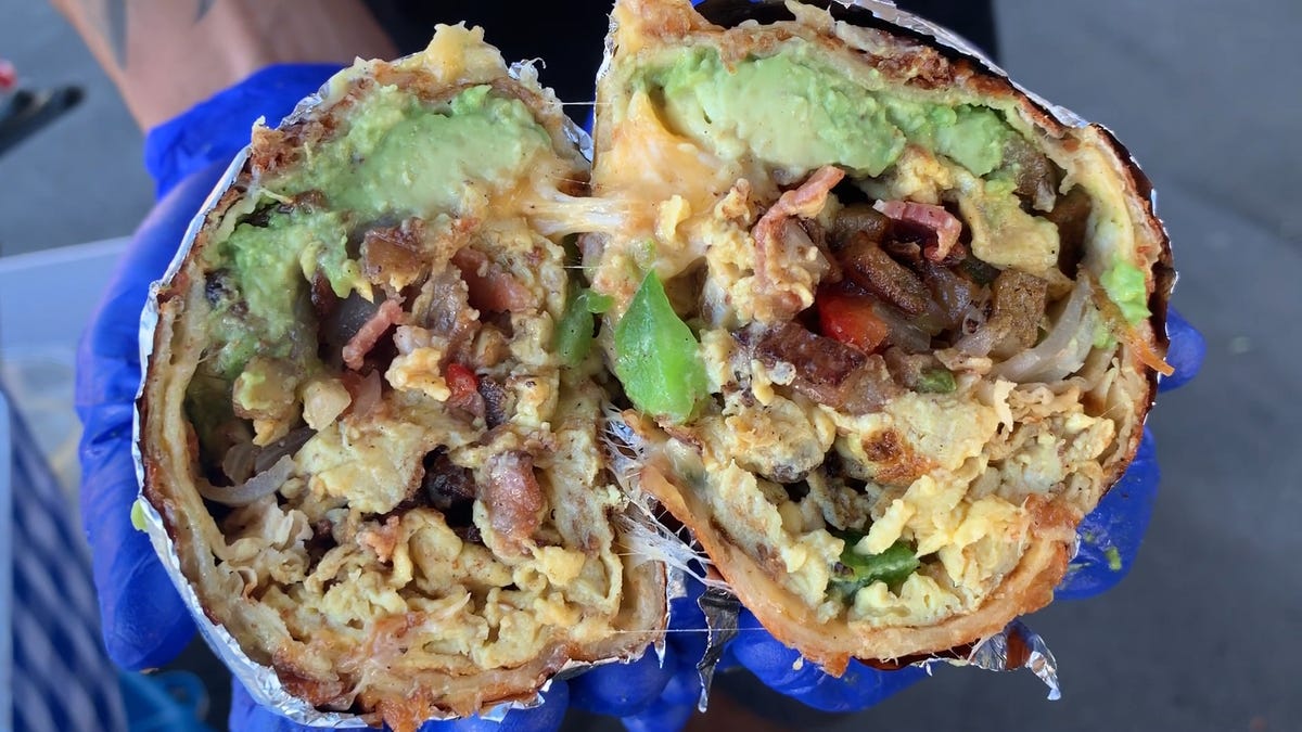 preview for This Breakfast Burrito Is Wrapped In An Actual Blanket Of Cheese