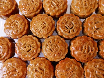 homemade mooncakes with shiny egg wash