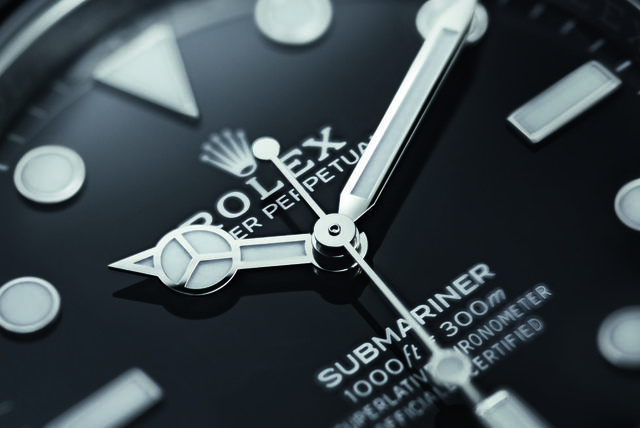 a close up image of the face of the new rolex submariner dive watch