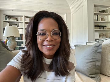 oprah in glasses and white and brown striped tshirt