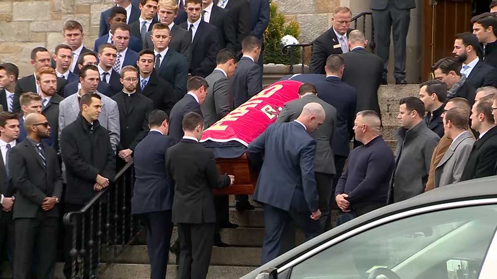 Friends and family depart following a funeral mass for Pete Frates