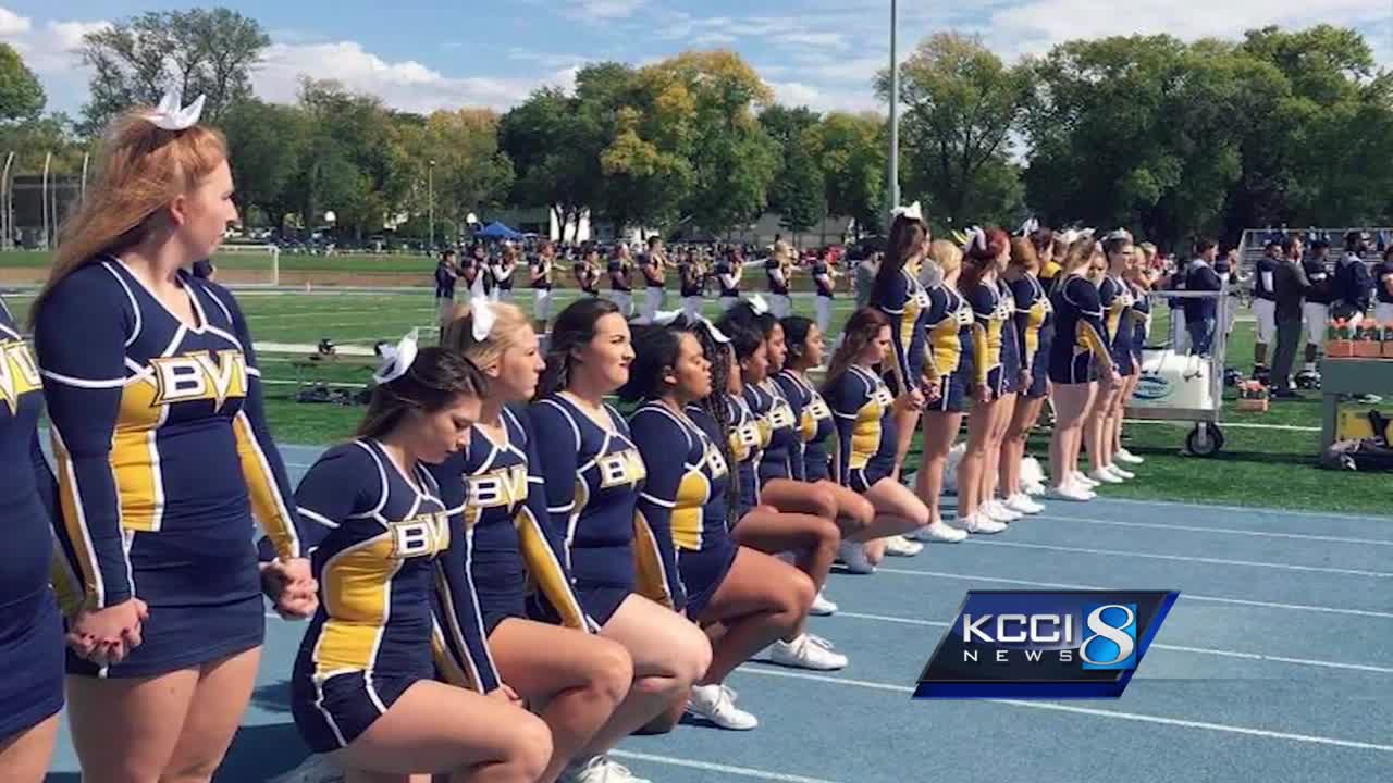 Woman becomes first NFL cheerleader to take a knee during national