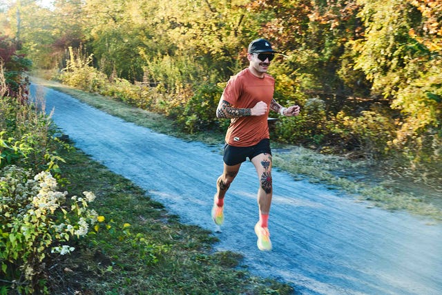 a runner on a gravel path along a canal