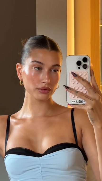 Hailey Bieber glitters in pink minidress for Rhode party