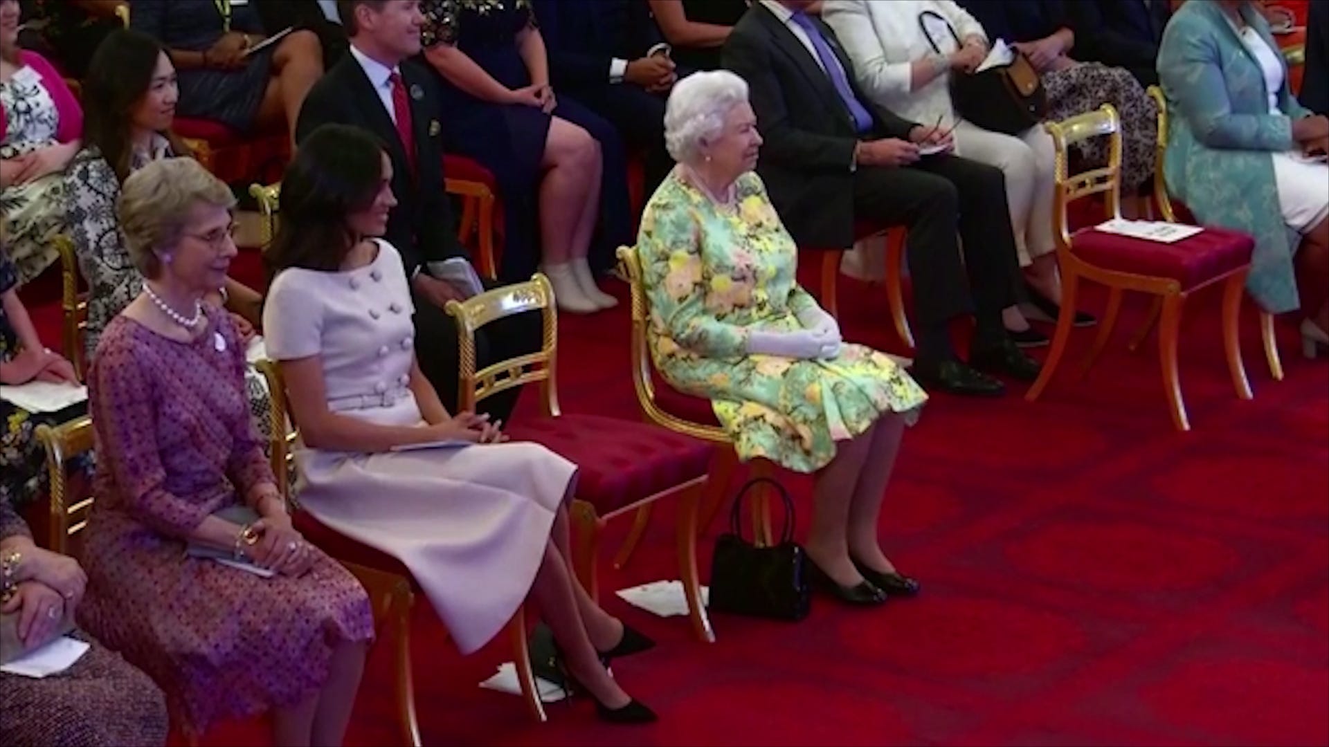 Meghan Markle Glows In Pink Prada For A-List Reception At Buckingham Palace