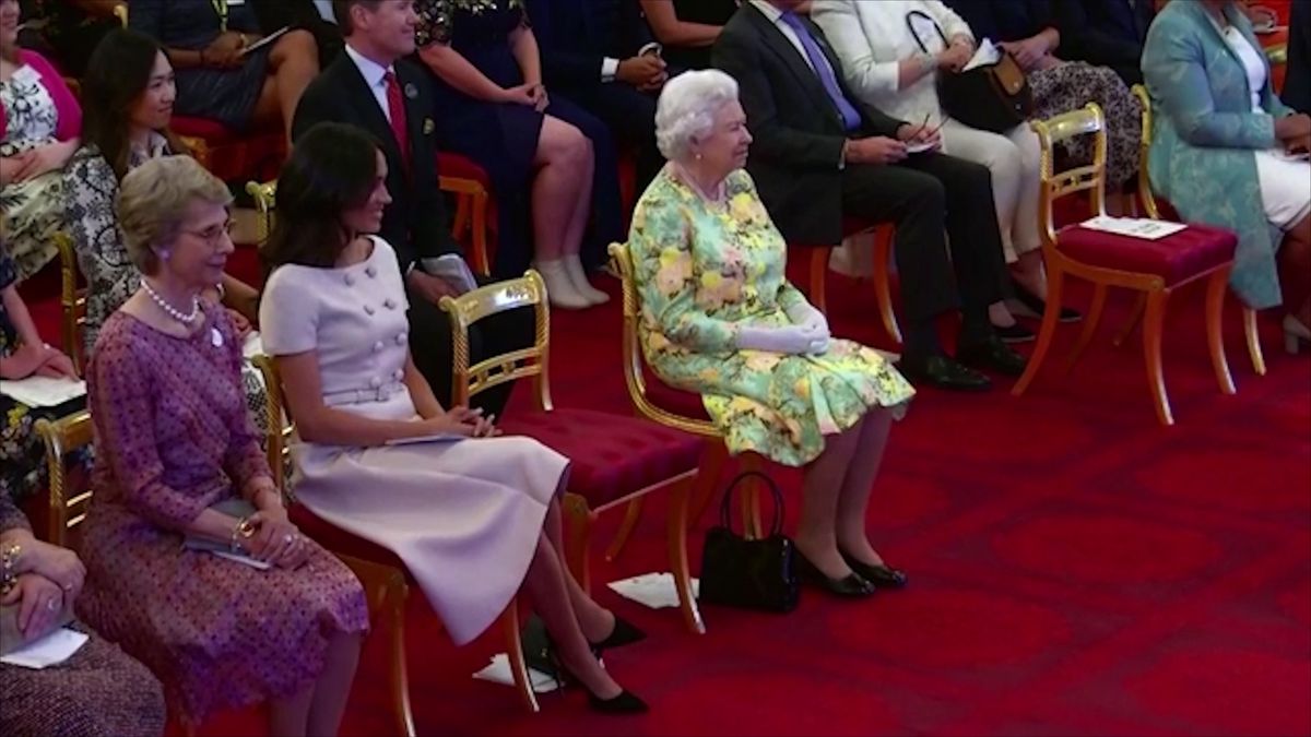 preview for Meghan Markle and the Queen laugh at Prince Harry's joke in Buckingham Palace speech