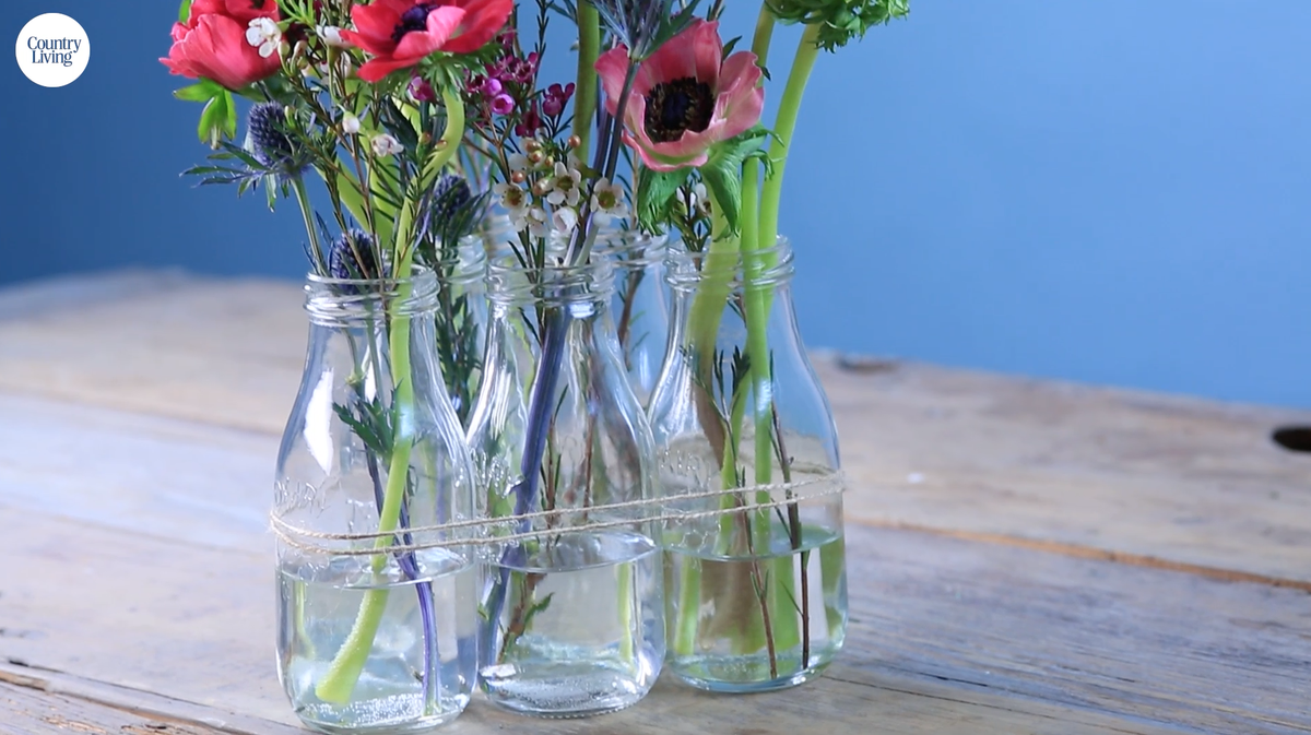 preview for This Milk Bottle Flower Arrangement is the Easiest Centerpiece for Spring