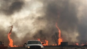 preview for Watch a fire tornado twist through a Missouri brush fire