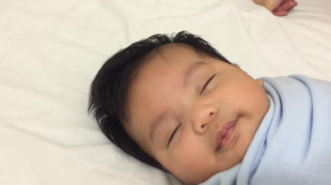 baby sleeping on face