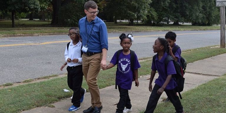 These Heartwarming Photos Of Devoted Teachers Walking Their Students